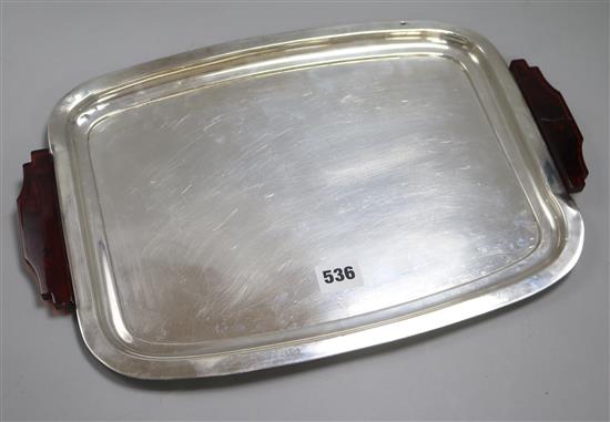 An Art Deco white metal rounded rectangular tray with red Bakelite handles (one a.f) l. 41.5cm